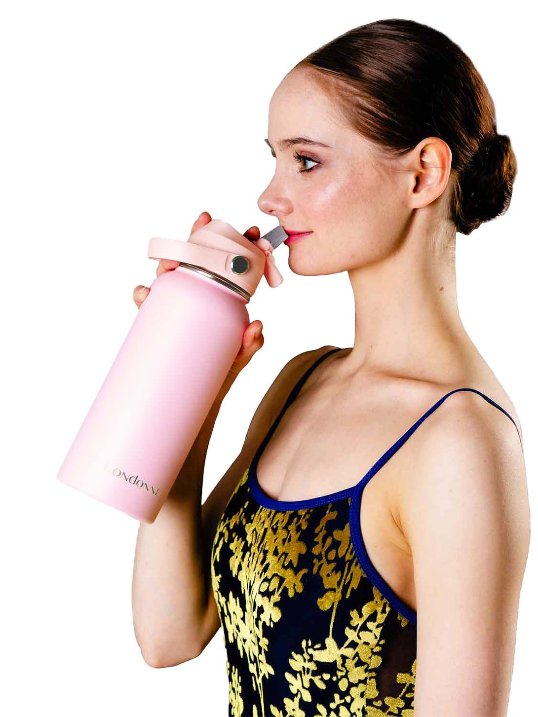 dancer drinking out of stainless steel pink water bottle Londonne