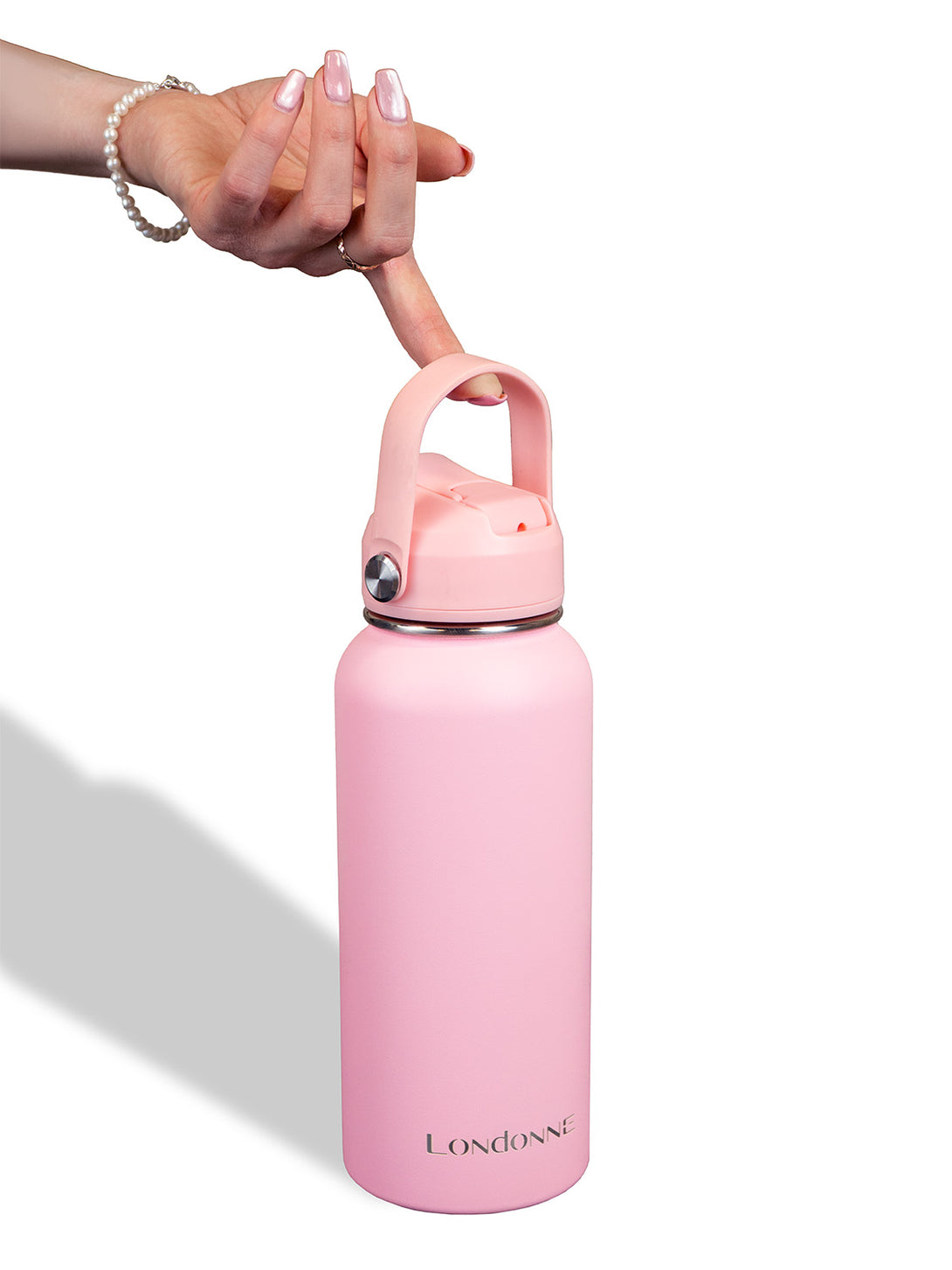 Hand holding Londonne pink stainless steel water bottle